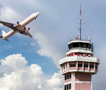Airliner passing by an airport control tower