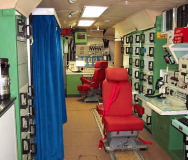 missile control room with a chair and a computer
