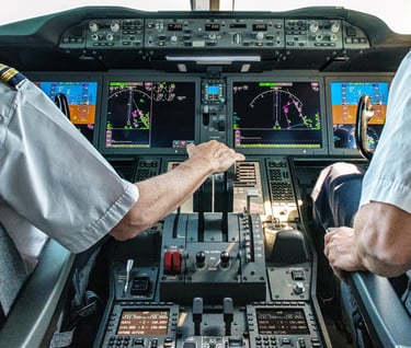 two pilots in a cockpit of a plane