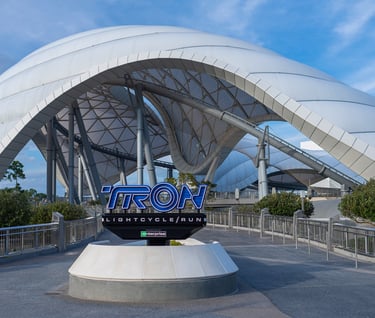 a large white building with a large metal structure