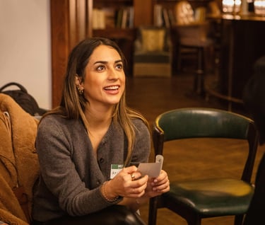 Young female professional looking supportive and smiling at workshop