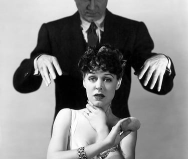 Bela Lugosi menaces a victim