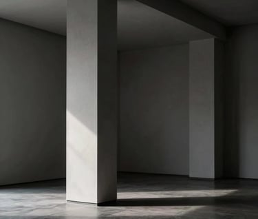 A high-contrast architectural interior shot with deep charcoal shadows and bright light gray highlights. A single column stands in a minimalist Northern European gallery space. Refined and artistic mood.