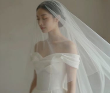An artistic videography still showing a bride's veil flowing in the wind. The motion blur creates a sense of authentic storytelling, featuring soft tones of #CFC7BB and a professional, artistic flair.