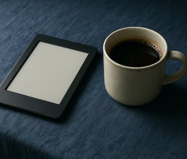A minimalist still life featuring an e-reader and a ceramic cup of Brazilian coffee on a deep blue textured linen surface, soft natural light coming from the side.