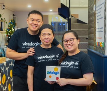 a team of 3 founders in uniform posing in a restaurant