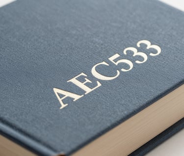 A detailed shot of the spine of a limited edition book, featuring embossed lettering. The material is a sophisticated textured cloth in #293B37 with foil-stamped text in #AEC5BE. Minimalist and refined style.