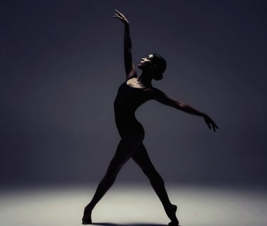 A silhouette of a dancer against a backdrop of deep #1F1E1C and #8F8C8A, focusing on the expression of the body and the geometry of movement. Moody and evocative.