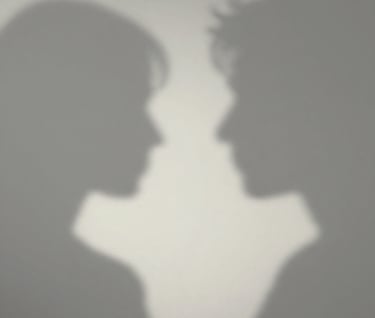 An artistic composition of shadows on a wall, suggesting a human profile, minimalist and emotive, using a mix of #8F8C8A and #F5F2EF.