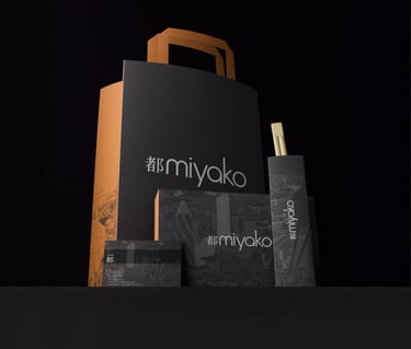dark grey and orange paper takeaway bag menu and chopsticks on grey background 