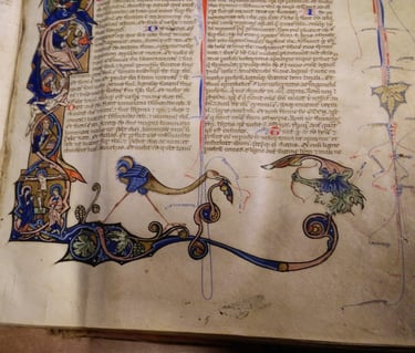 A lavishly decorated page of a bible, 13th Century, Italy.