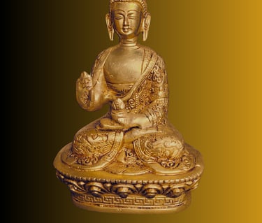 a golden buddha statue sitting on a gold pedestal