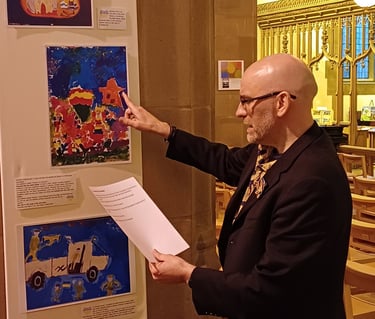 Poetry reading at Liverpool church showcasing paintings created by kids in the Ukrainian war