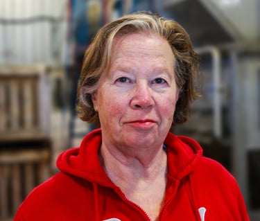 Rosemary Wotske Founder of Poplar Bluff Organics wearing red sweater