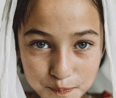 blue eye afghani girl look at you