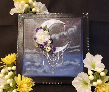 a painting of a crescent moon with flowers and crystals.