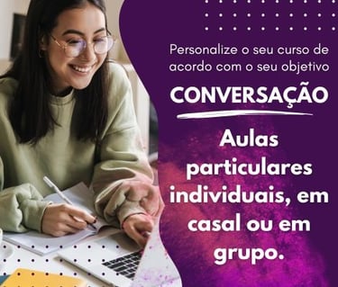 a woman sitting at a table with a laptop and a notebook