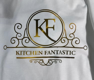 Elegant gold foil Kitchen Fantastic logo with KF monogram printed on a white garment.