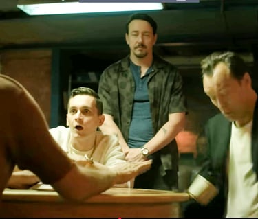 Law's character Jake getting a cup of coffee knocked into his lap on the series Black Rabbit