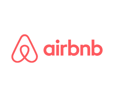 The pink Airbnb logo and wordmark centered on a solid black background.