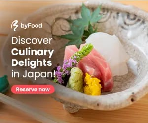 Fresh sashimi platter with tuna and white fish served in a traditional Japanese ceramic bowl.