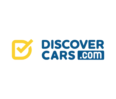 DiscoverCars.com logo featuring a yellow checkmark icon on a black background for car rental bookings.