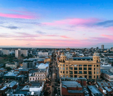 A drone image looking south down Chapel Street Precinct at sunrise