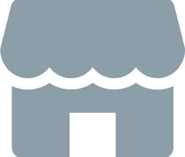 Icono gris de una fachada comercial que representa un negocio local con toldo festoneado y entrada.