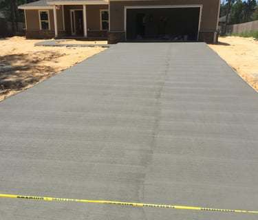Concrete driveway installation for residential home with smooth finish concrete surface