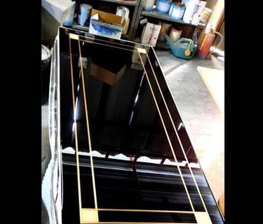 a black and gold table top with a black and gold frame