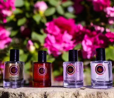 a group of bottles of envoke's perfumes and fragrances