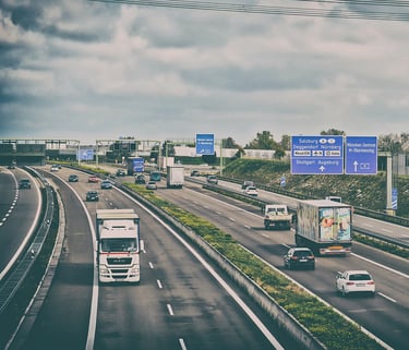 trucks and cars on a highway