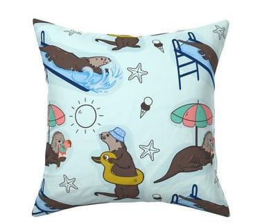 a pillow with a sea otter on it