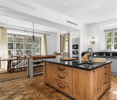 Kitchen view with island and wooden floors at Finca Santa Katerina