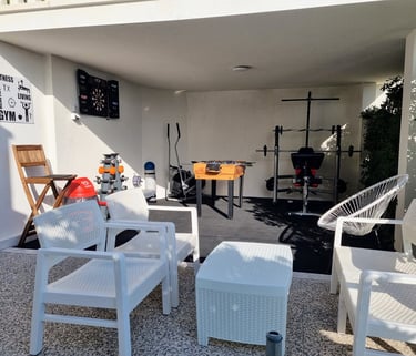 The photo shows an outdoor Fun and Fitness area with home equipment.