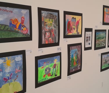 Display showing Ukrainian kids paintings in VALA