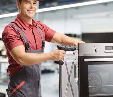 a man in a red shirt and a red hat is holding a drillet