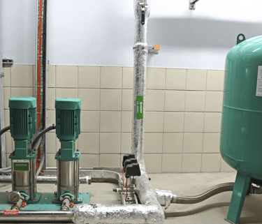 a large green tank with a green tank and a blue tank