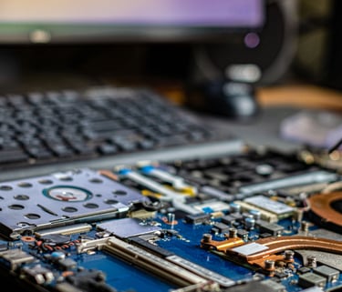 a person is holding a small piece of metal