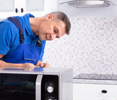 a man in a blue shirt and blue overall overall overall overall overall overall overall overall