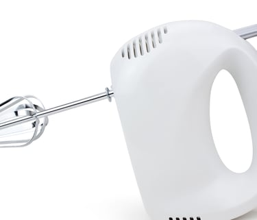 a white hand held mixer with a hand held mixer
