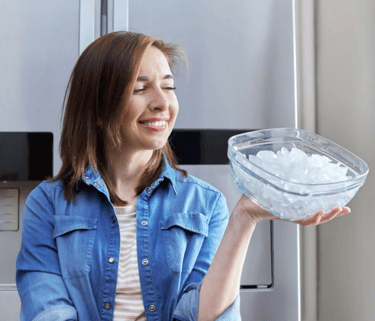 a woman holding a bowl of ice cream
