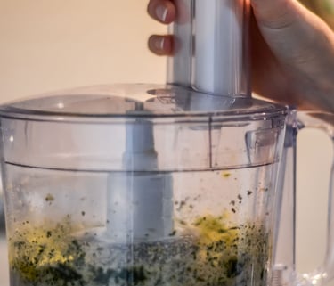 a person is holding a blender in a blender