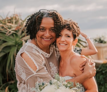 Jacquelyn, San Diego Destination Weddings hugs bride, wedding at Moonlight Beach Overlook, Encinitas
