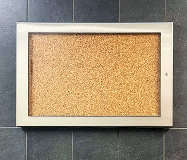 memo board mounted in tile wall