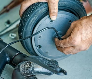 a man is holding a wheelbar while he is working on a wheel