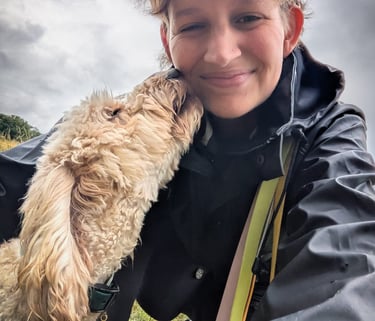 Image of a dog licking a woman's face