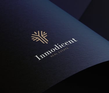 a close up of a real state book with a logo on it