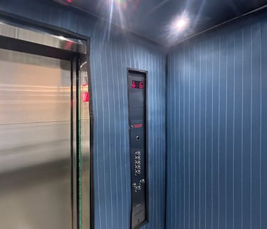 elevator interior with protection pads installed to protect the walls during moves