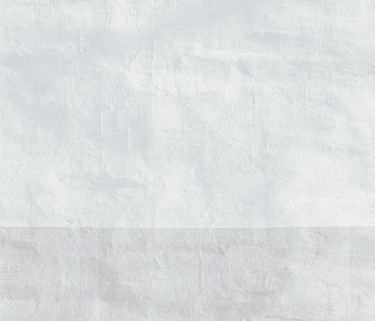 Minimalist white textured plaster wall with a subtle grey horizontal band at the base.